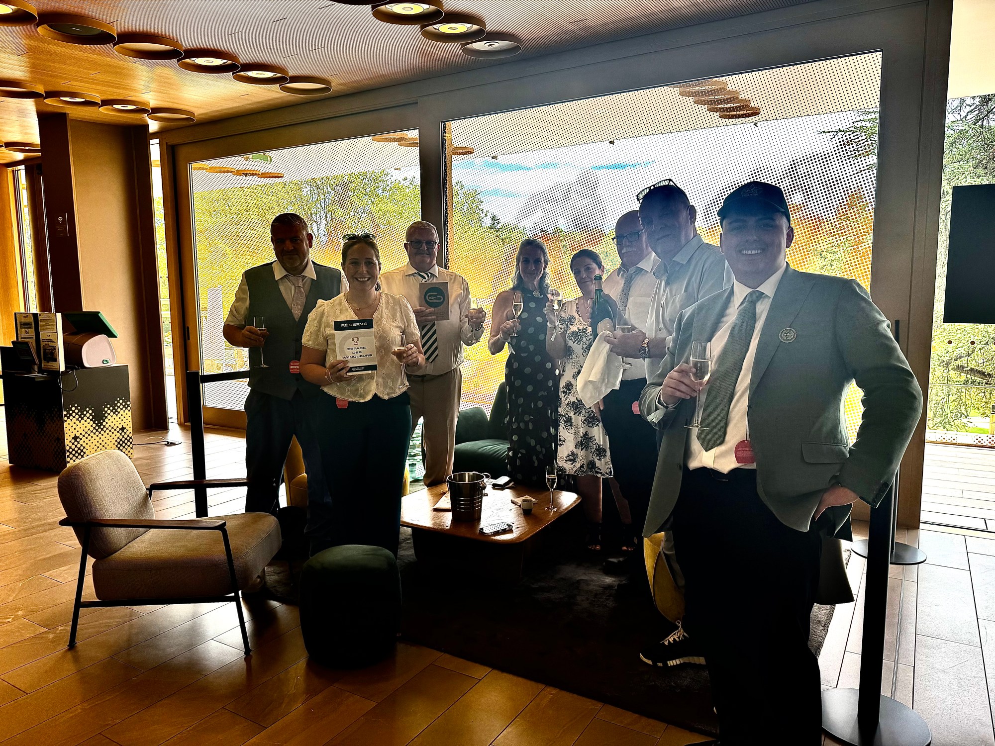 Members celebrating at ParisLongchamp