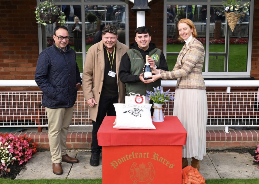 Members receive the winning presentation